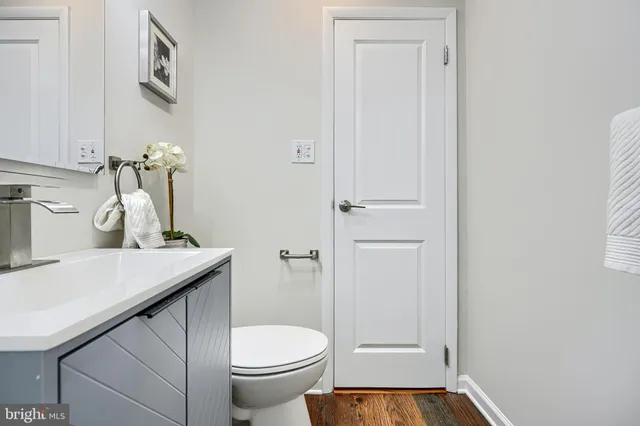 a bedroom with a bed and a ceiling fan