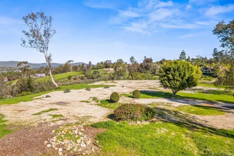 a view of a yard with an outdoor space