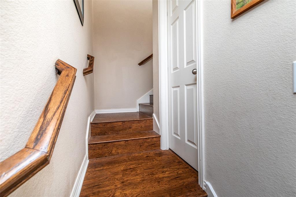 3118 Bedford Road Bedford, TX 76021 - Photo 16 of 29 Wood-finish staircase featuring a coordinating wood handrail