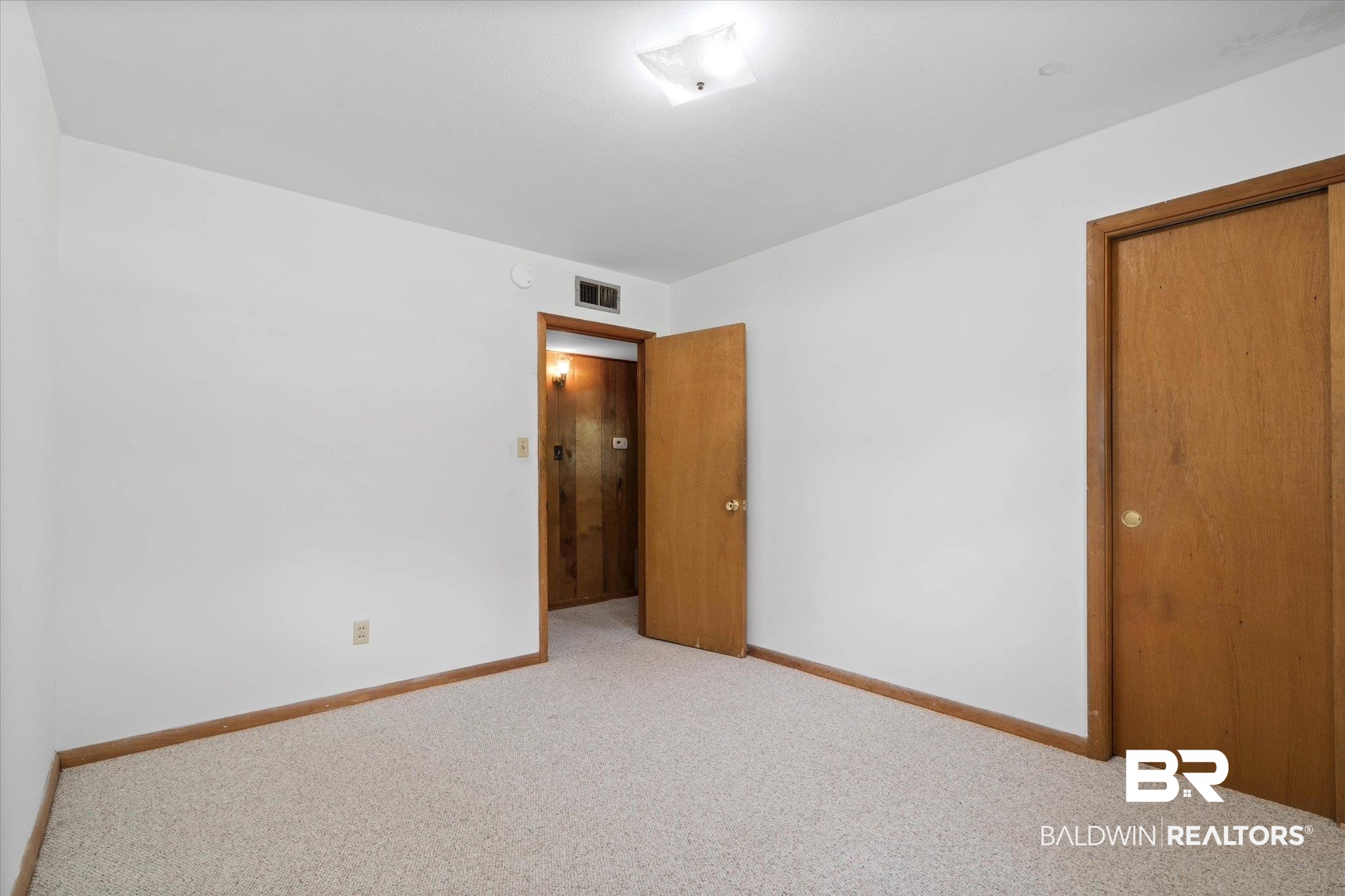 423 First Avenue Saraland, AL 36571 - Photo 15 of 20 Unfurnished room with carpet floors and baseboards