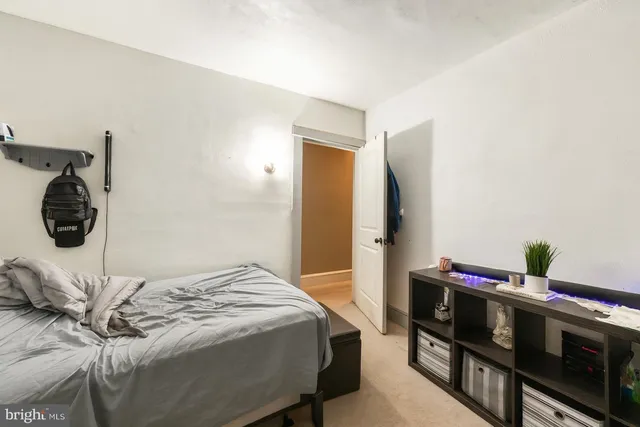 a bedroom with a bed and a dresser