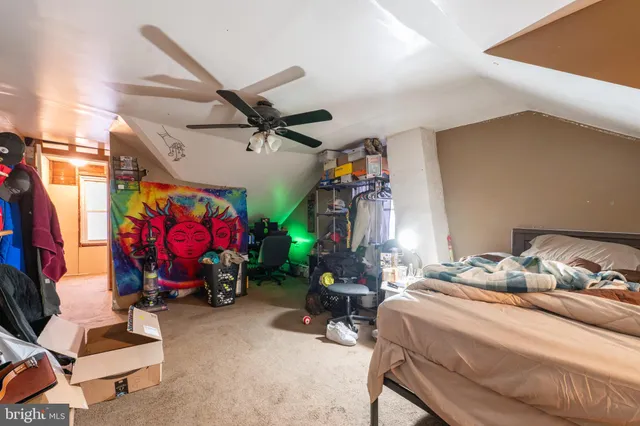 a bedroom with bed and a window