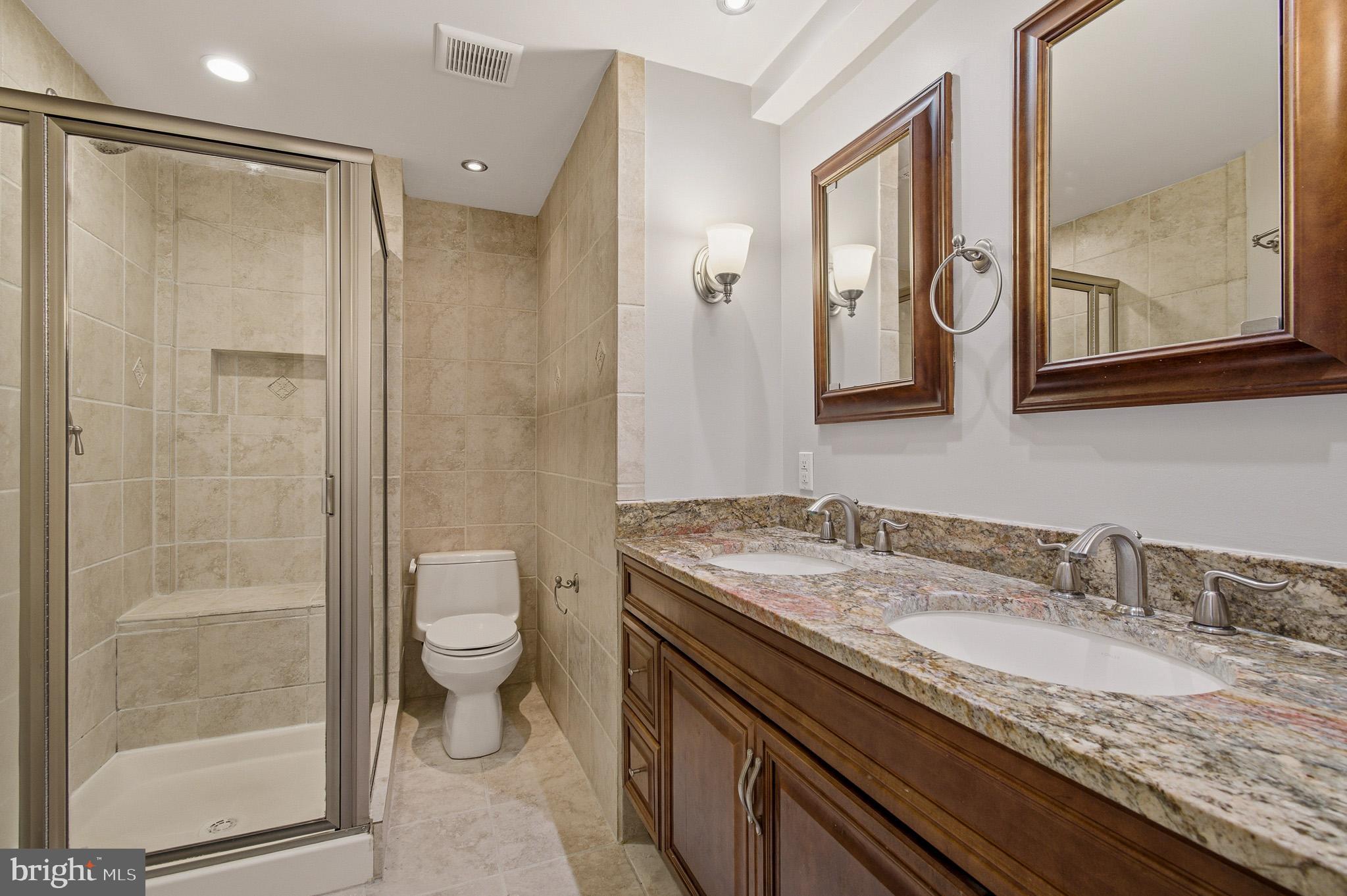 2117 S Street Northwest Washington, DC 20008 - Photo 60 of 63 a bathroom with a granite countertop sink toilet and shower