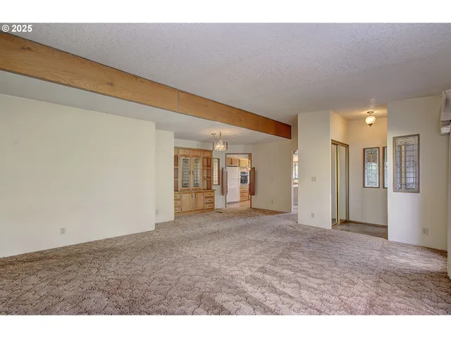 a view of a hallway with a window