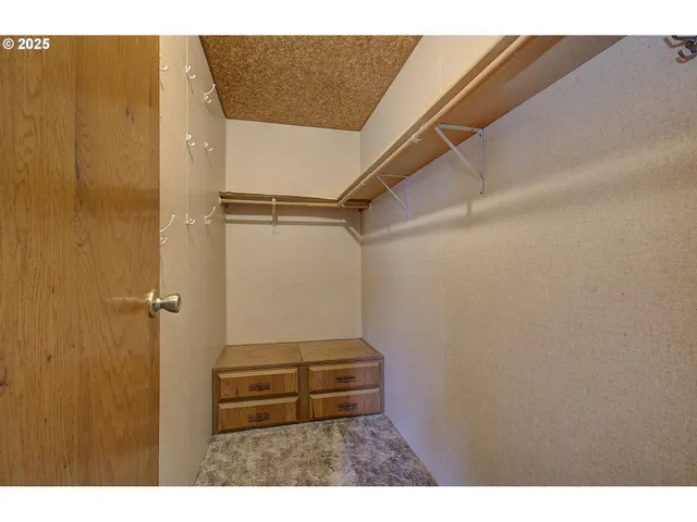 a bathroom with a sink a mirror and a shower