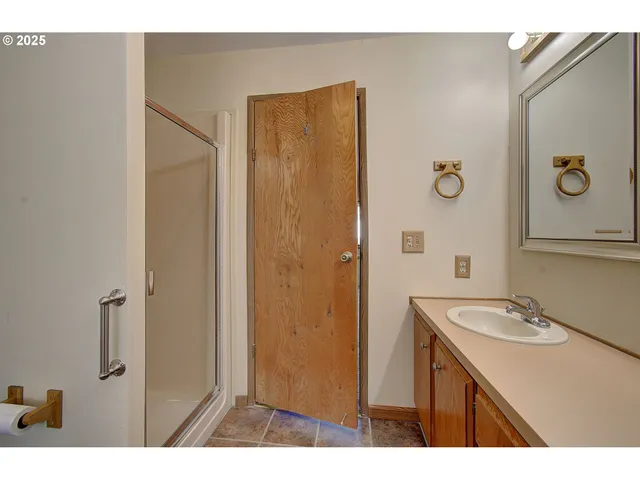 a bathroom with a sink a toilet and mirror