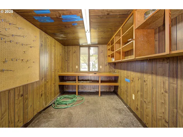 a view of a house with a big yard and potted plants