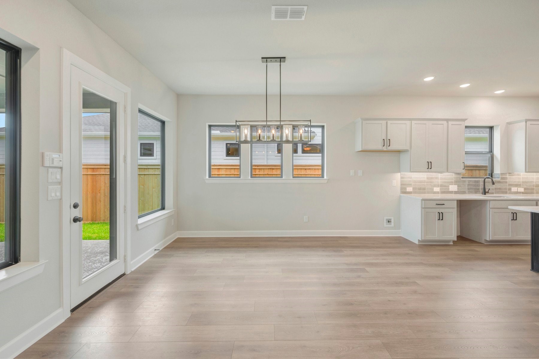 2722 Cottage Place Rosharon, TX 77583 - Photo 27 of 50 a view of an empty room with window and kitchen view