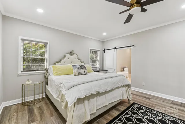 a bed room with a bed and a window