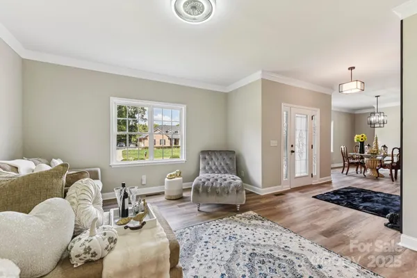 a living room with furniture window and a table