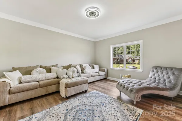 a living room with a couch and a window