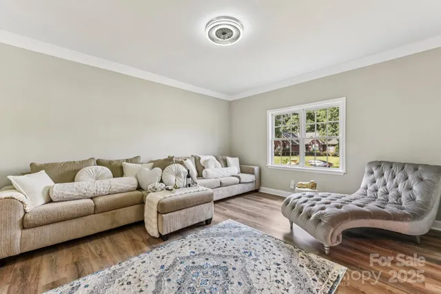 a living room with a couch and a window