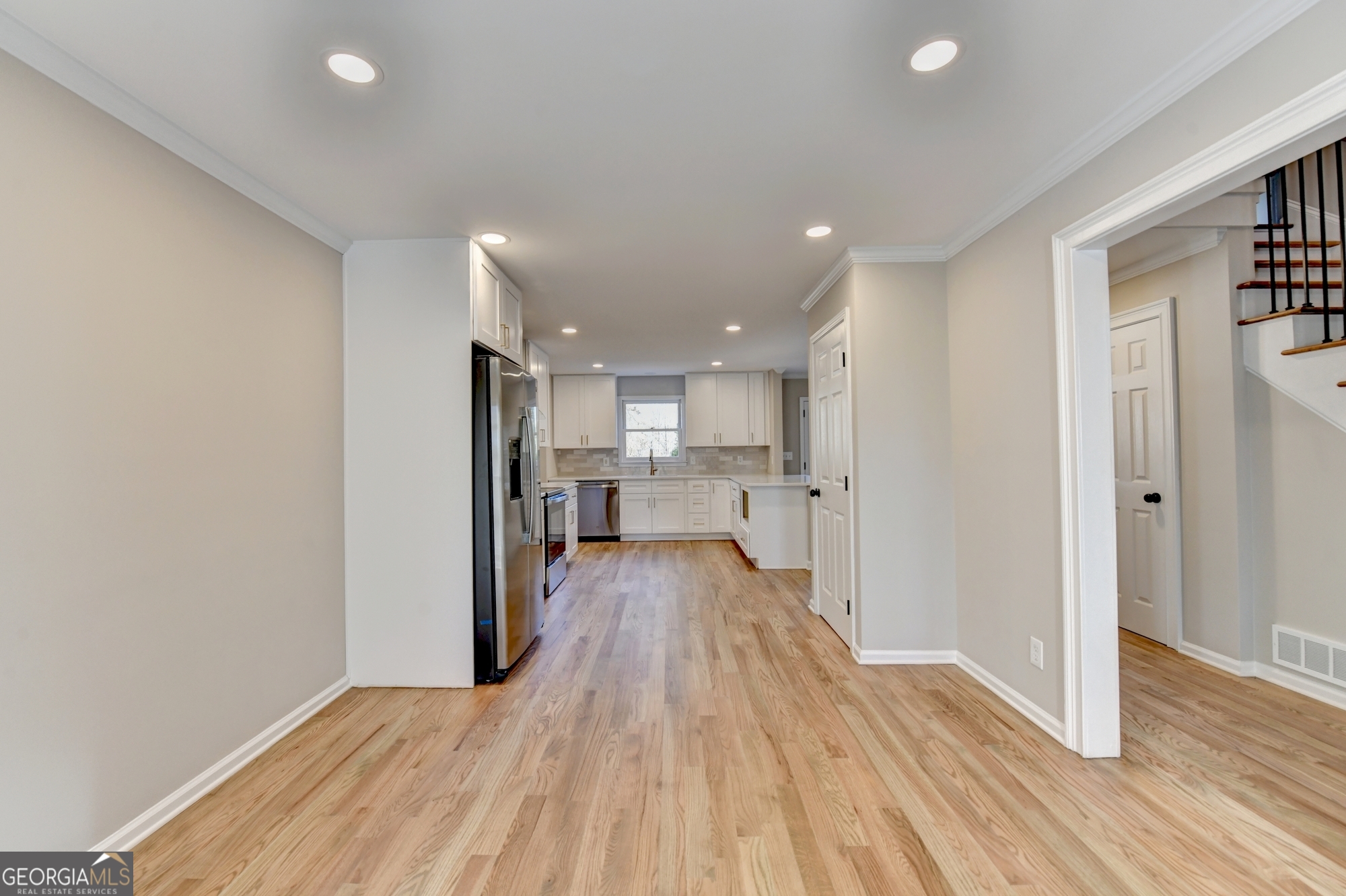 590 Manning Gin Road Monroe, GA 30656 - Photo 12 of 76 a view of a kitchen with wooden floor