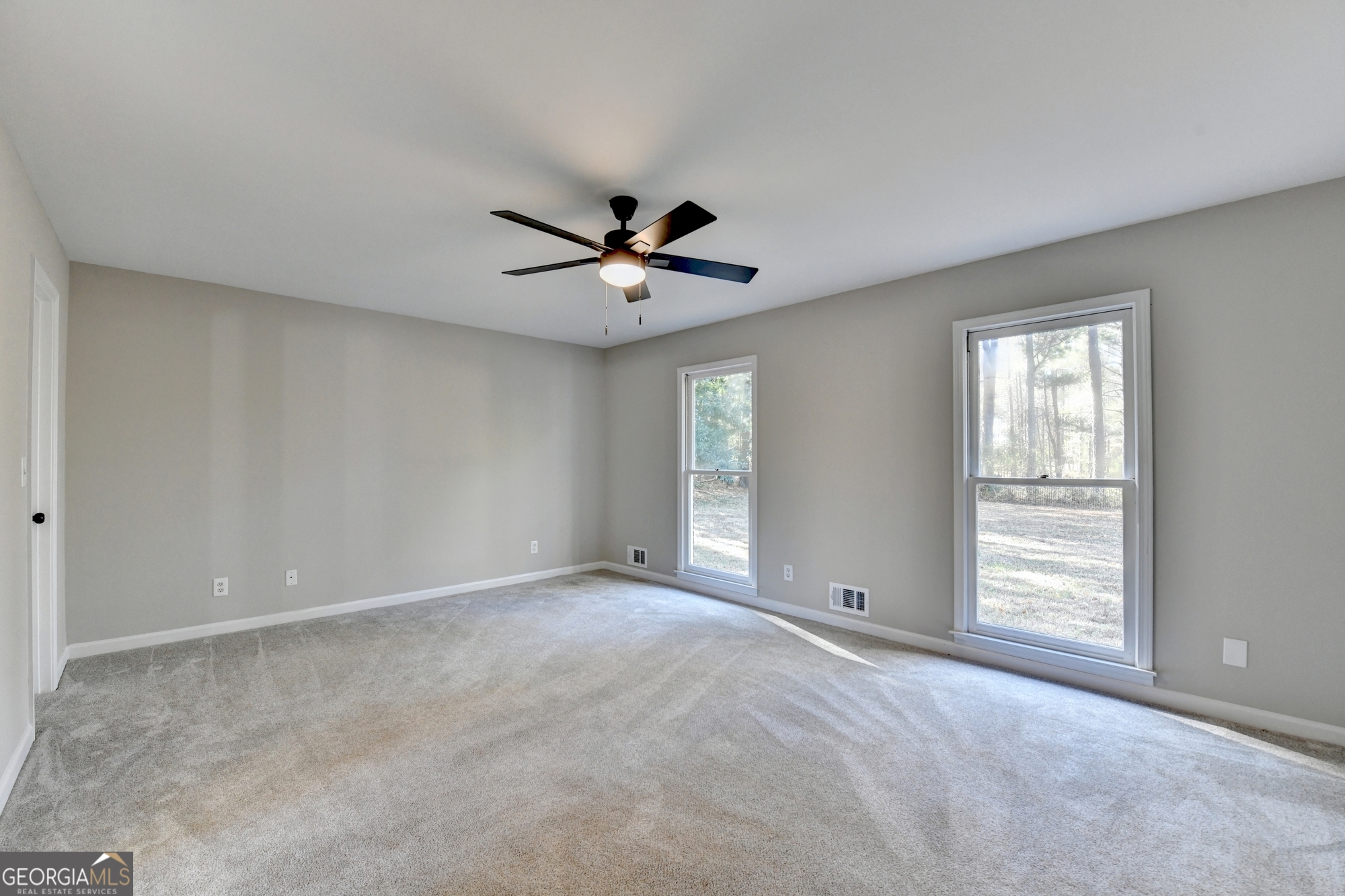 590 Manning Gin Road Monroe, GA 30656 - Photo 30 of 76 a view of an empty room with a window