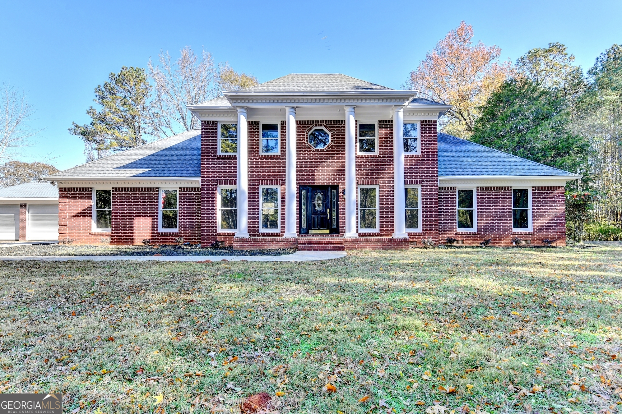 590 Manning Gin Road Monroe, GA 30656 - Photo 3 of 76 front view of a brick house with a yard