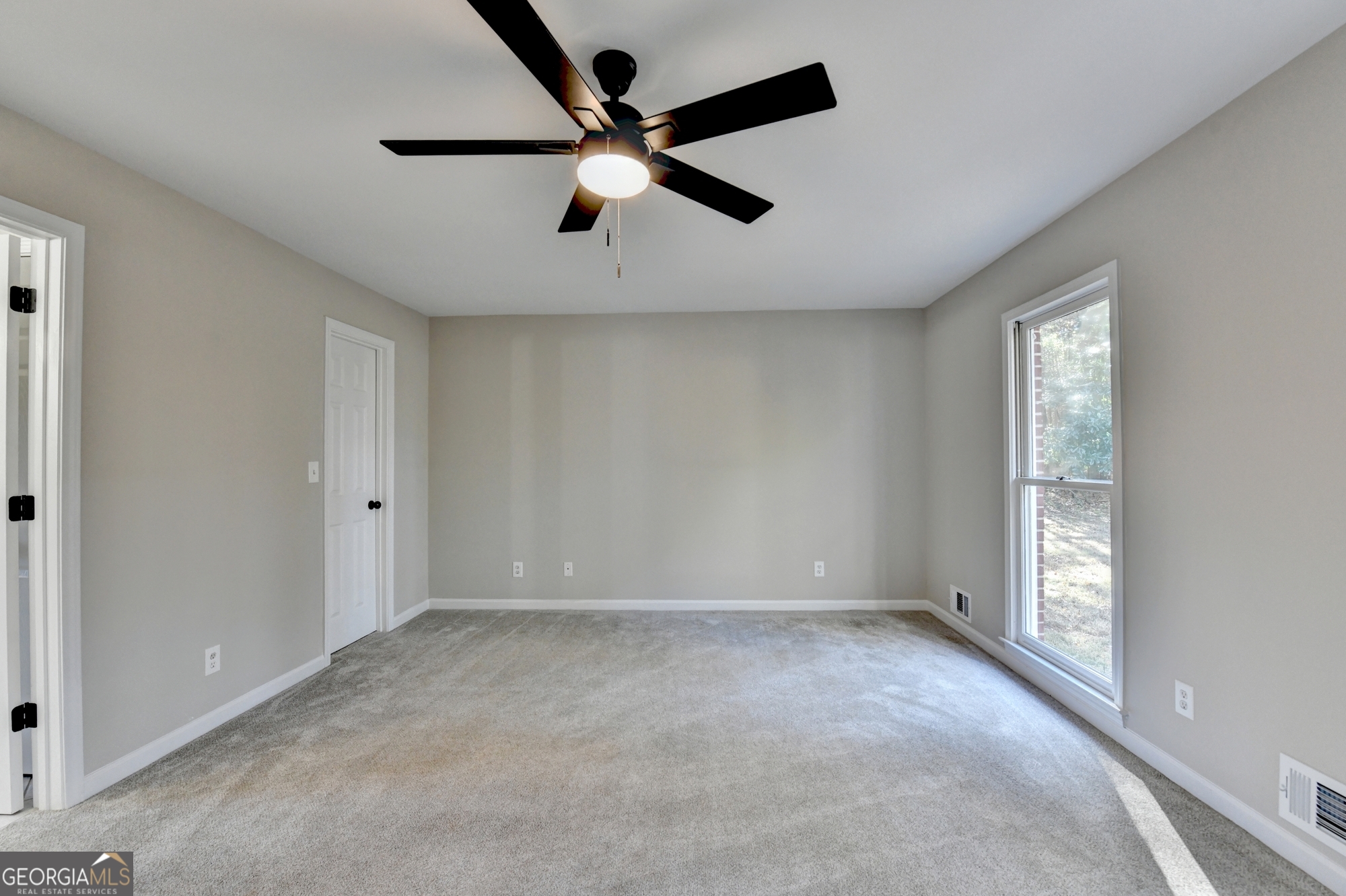590 Manning Gin Road Monroe, GA 30656 - Photo 31 of 76 a view of an empty room with a window