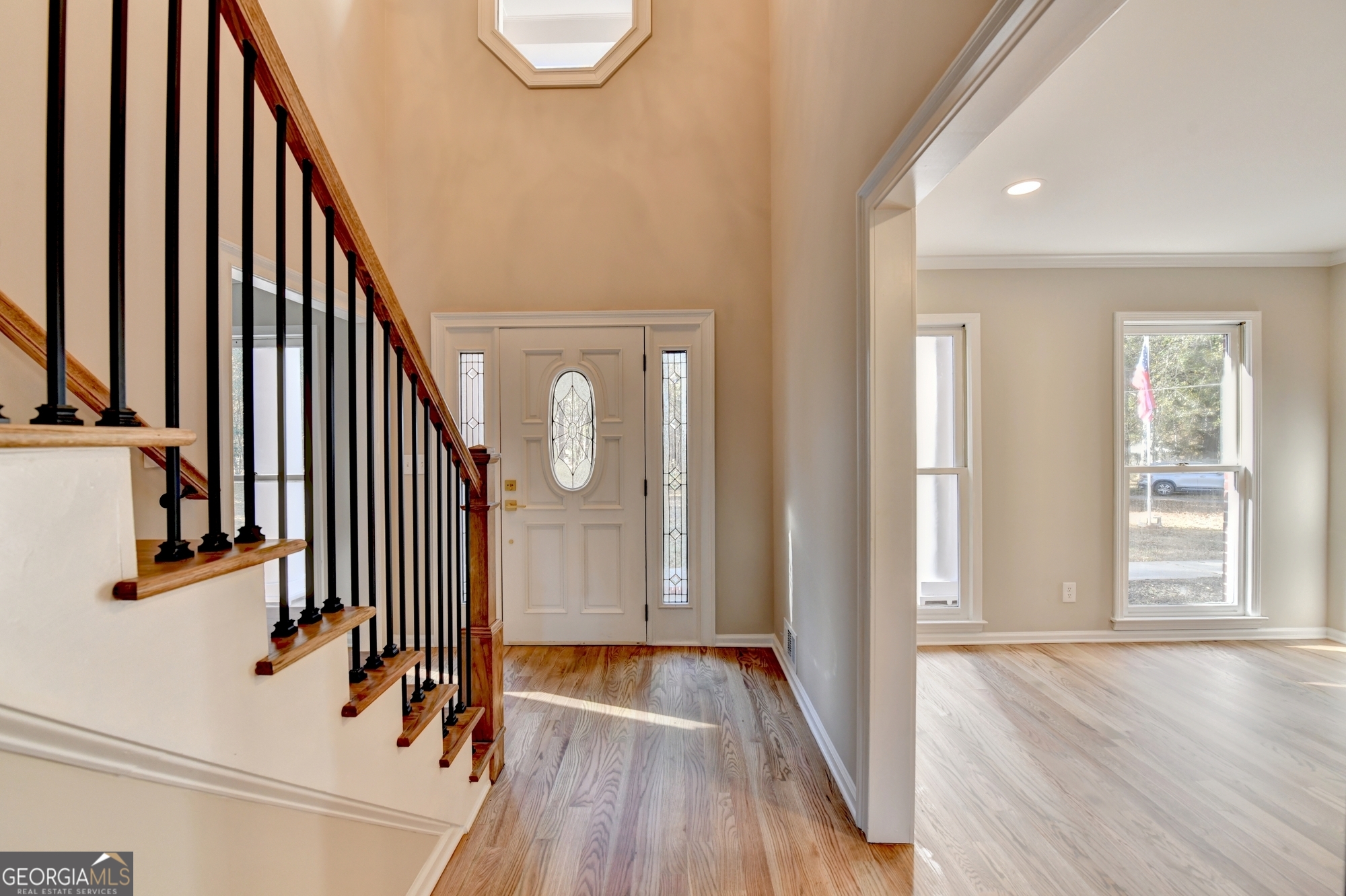 590 Manning Gin Road Monroe, GA 30656 - Photo 4 of 76 a view of a hallway with wooden floor and staircase