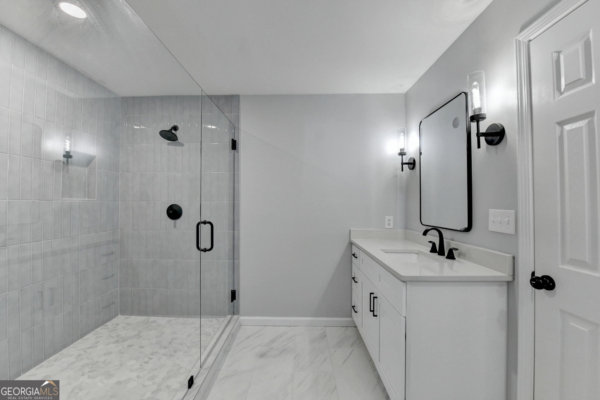 590 Manning Gin Road Monroe, GA 30656 - Photo 48 of 76 a bathroom with double vanity sink and mirror