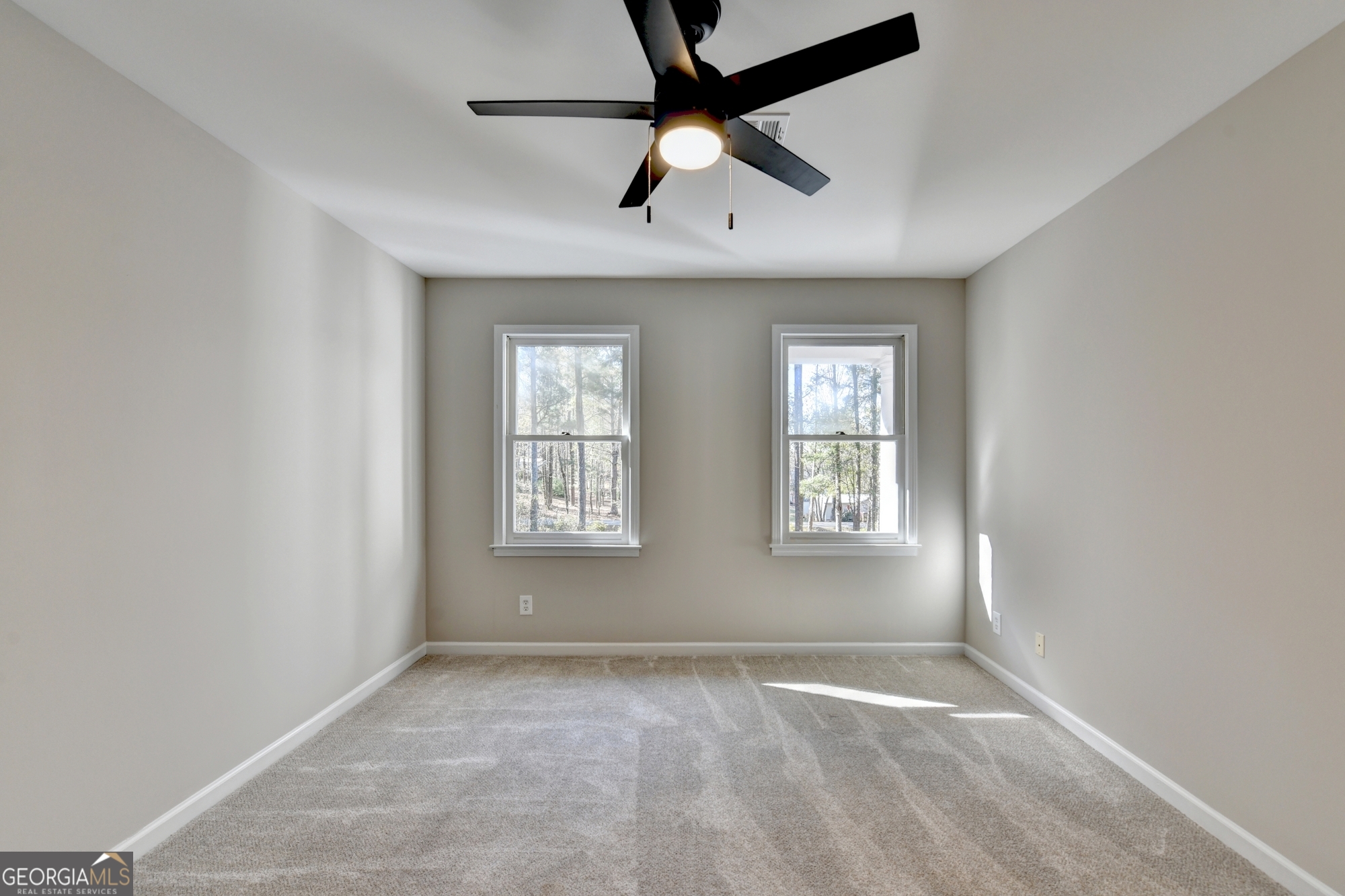 590 Manning Gin Road Monroe, GA 30656 - Photo 56 of 76 a view of an empty room with a window