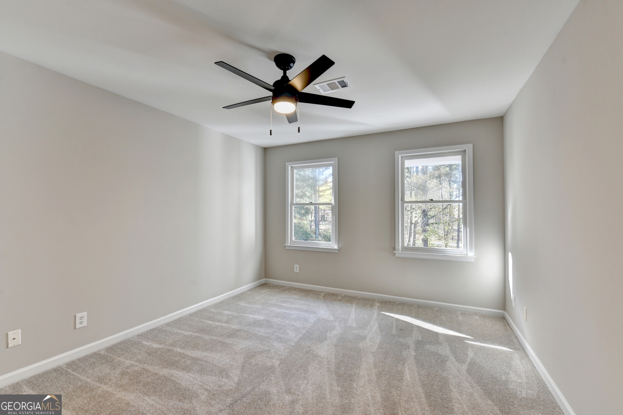 590 Manning Gin Road Monroe, GA 30656 - Photo 57 of 76 a view of an empty room with a window