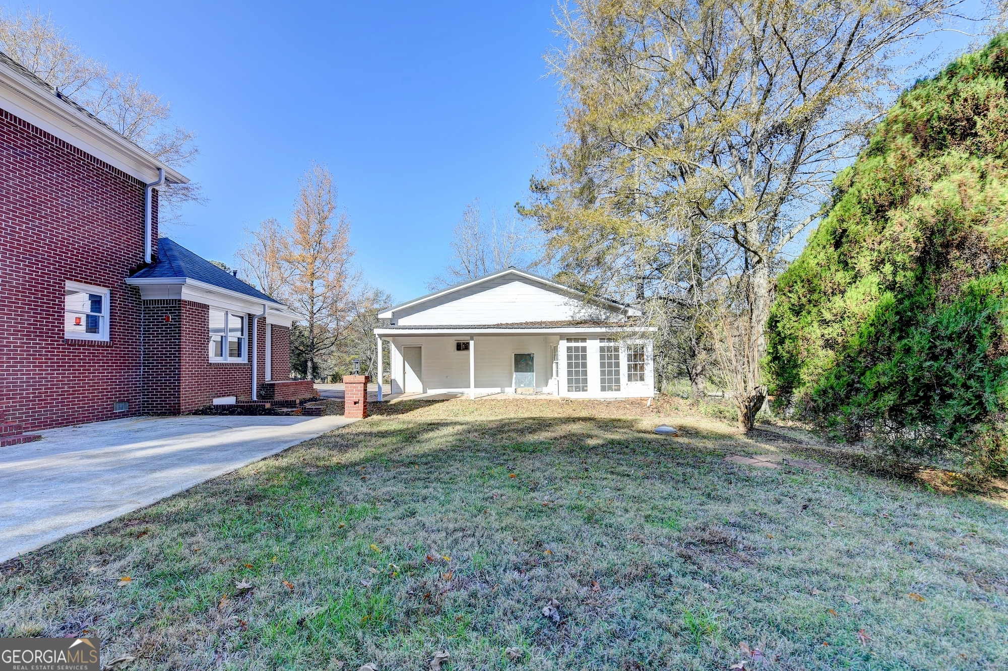 590 Manning Gin Road Monroe, GA 30656 - Photo 67 of 76 a front view of a house with yard and trees