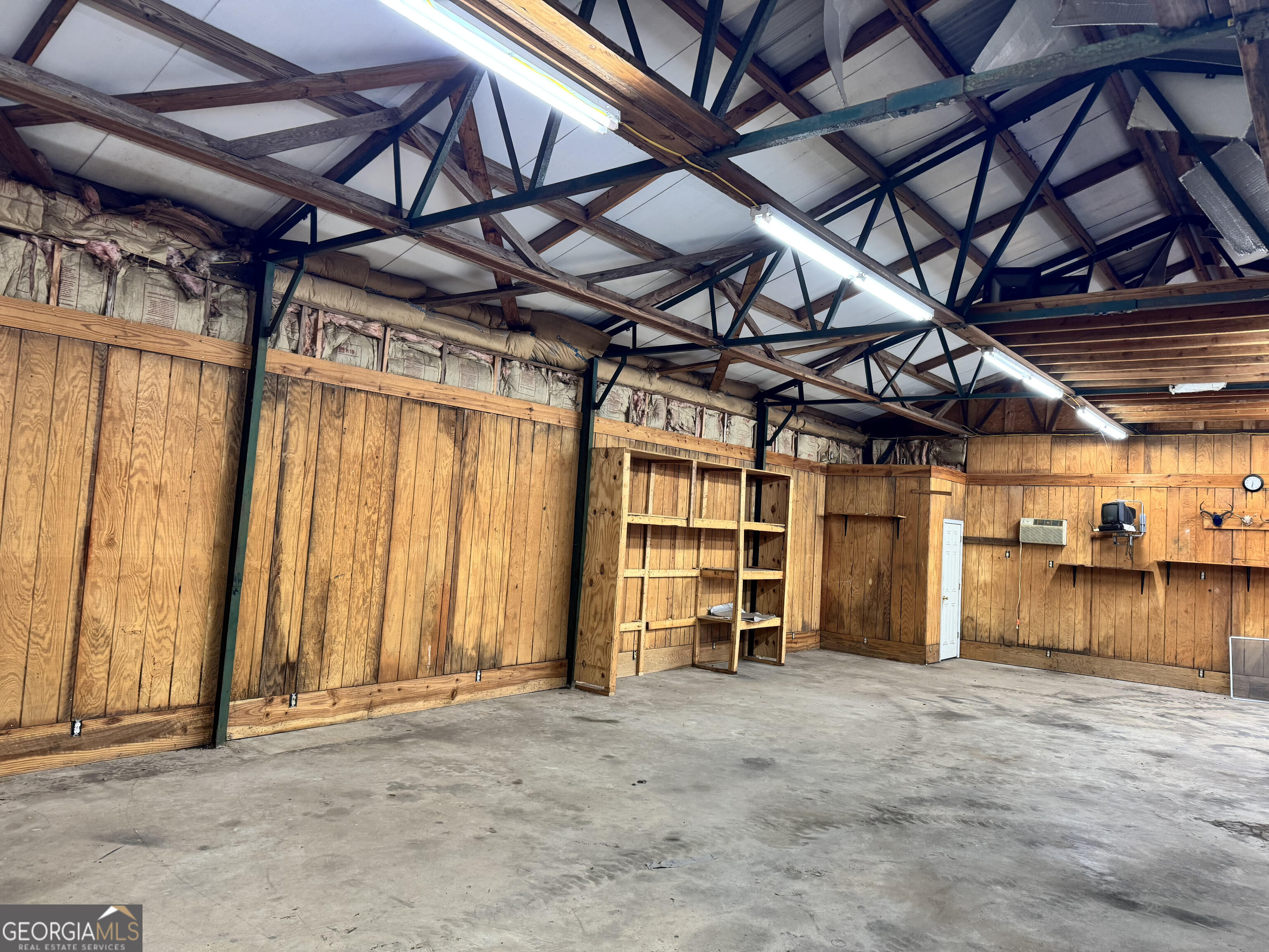 590 Manning Gin Road Monroe, GA 30656 - Photo 75 of 76 a view of a room with wooden walls