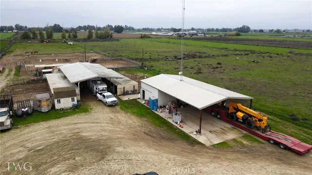 an aerial view of a house with outdoor space and street view