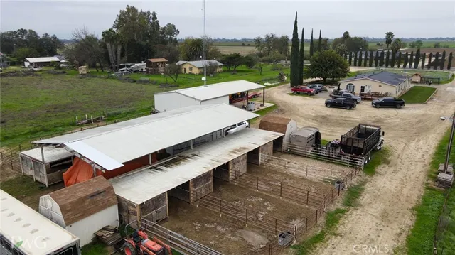 an outdoor sitting area with couch and a garden