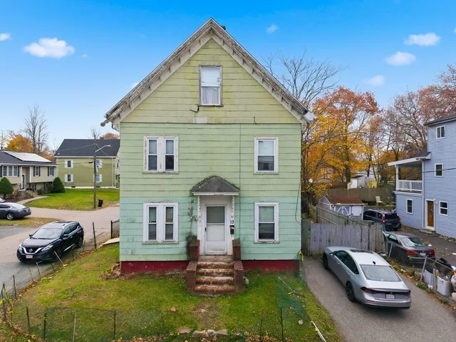 a view of a house with backyard porch and furniture