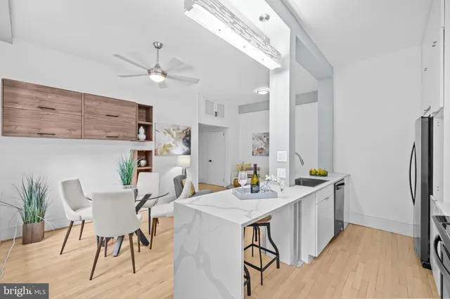 a view of a dining room with furniture and wooden floor