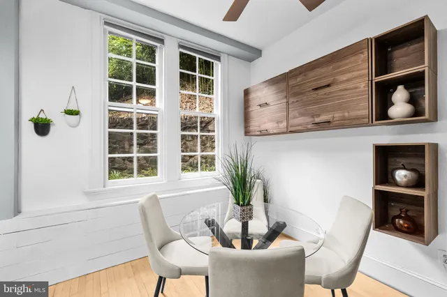 a dining room with furniture and window