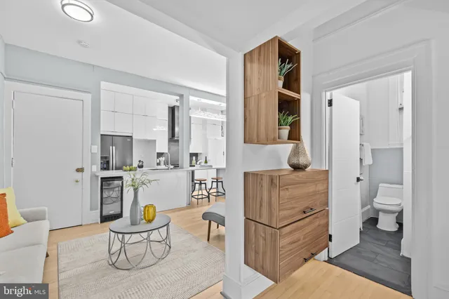 a living room with furniture and a toilet