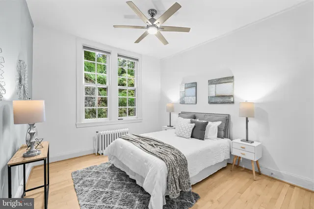 a bedroom with a bed and a table