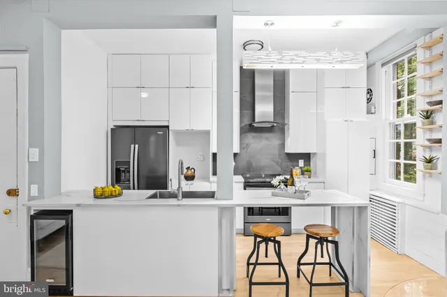 a kitchen with a sink cabinets and appliances