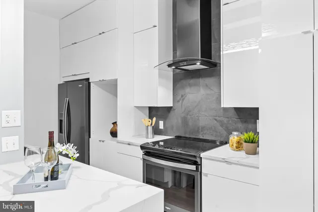 a kitchen with a stove and a refrigerator