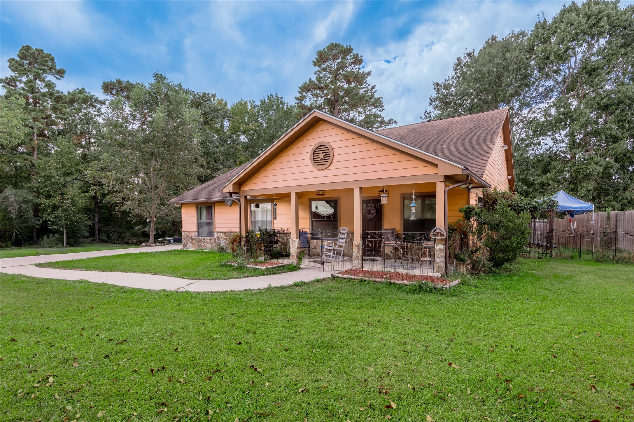 47-57 Stage Coach Road Coldspring, TX 77331 - Photo 31 of 50 a front view of a house with a yard patio and green space