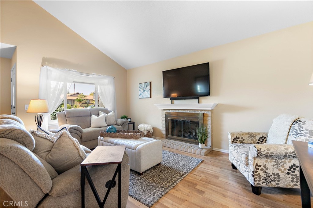 7241 Marine Avenue Rancho Cucamonga, CA 91701 - Photo 11 of 48 a living room with furniture and a fireplace