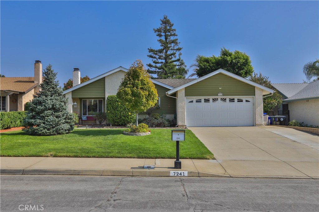 7241 Marine Avenue Rancho Cucamonga, CA 91701 - Photo 2 of 48 a front view of a house with a yard and garage