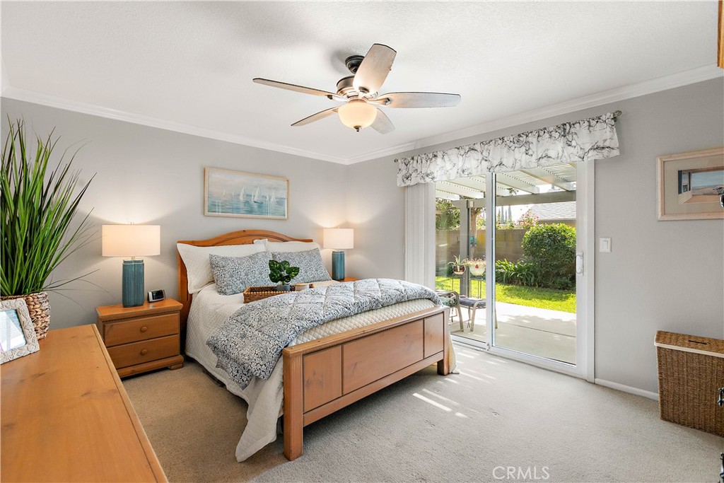 7241 Marine Avenue Rancho Cucamonga, CA 91701 - Photo 22 of 48 a bedroom with a bed and ceiling fan