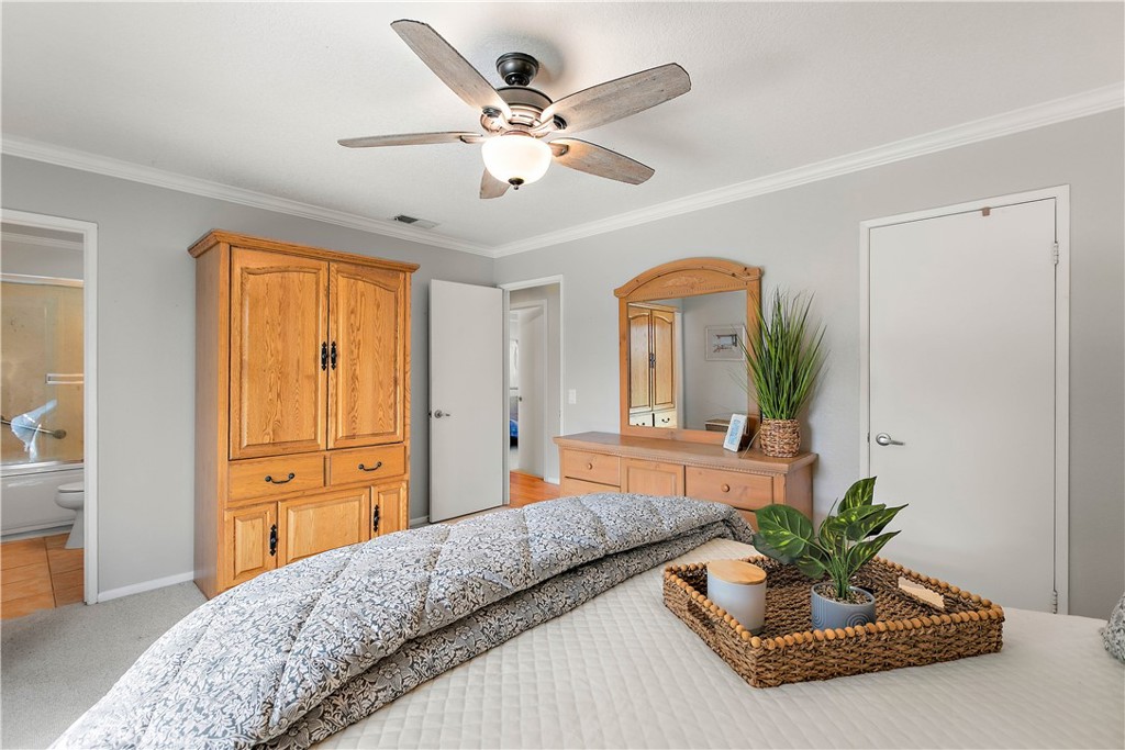 7241 Marine Avenue Rancho Cucamonga, CA 91701 - Photo 23 of 48 a bedroom with a large bed and a chandelier