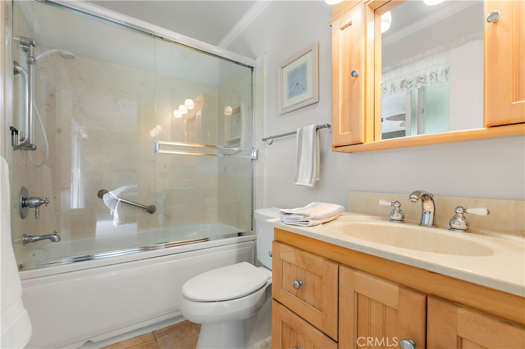 7241 Marine Avenue Rancho Cucamonga, CA 91701 - Photo 24 of 48 a bathroom with a sink a toilet and shower