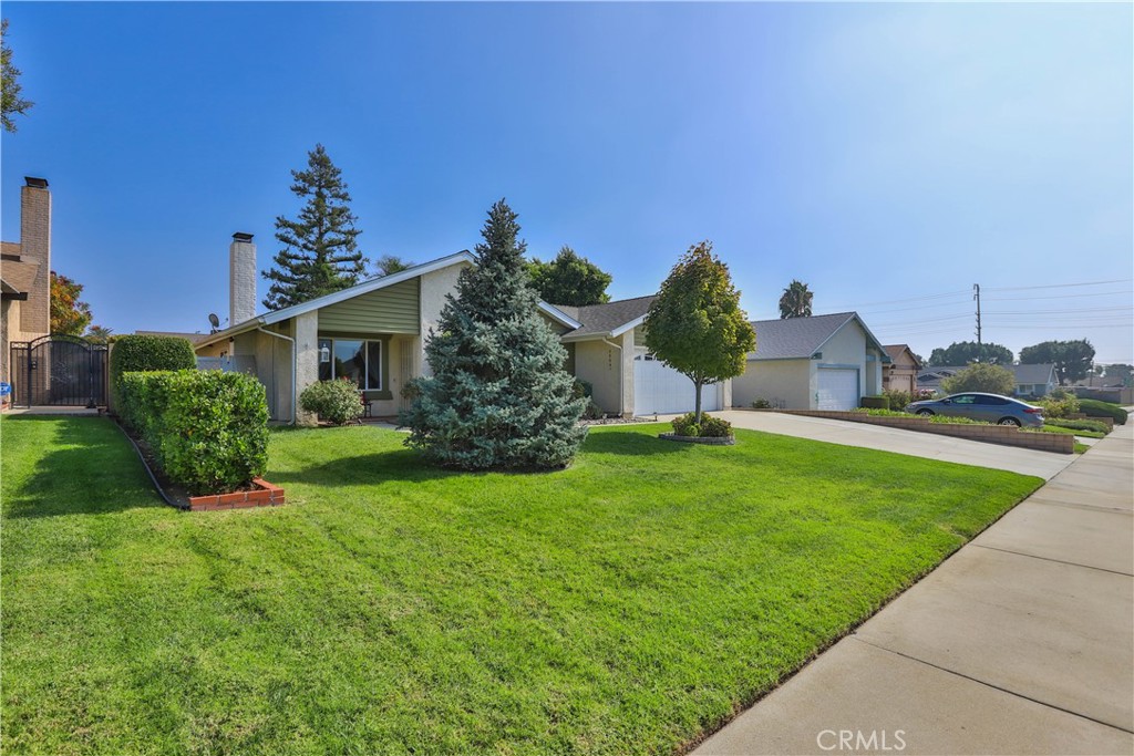 7241 Marine Avenue Rancho Cucamonga, CA 91701 - Photo 4 of 48 a view of a house with a yard and potted plants