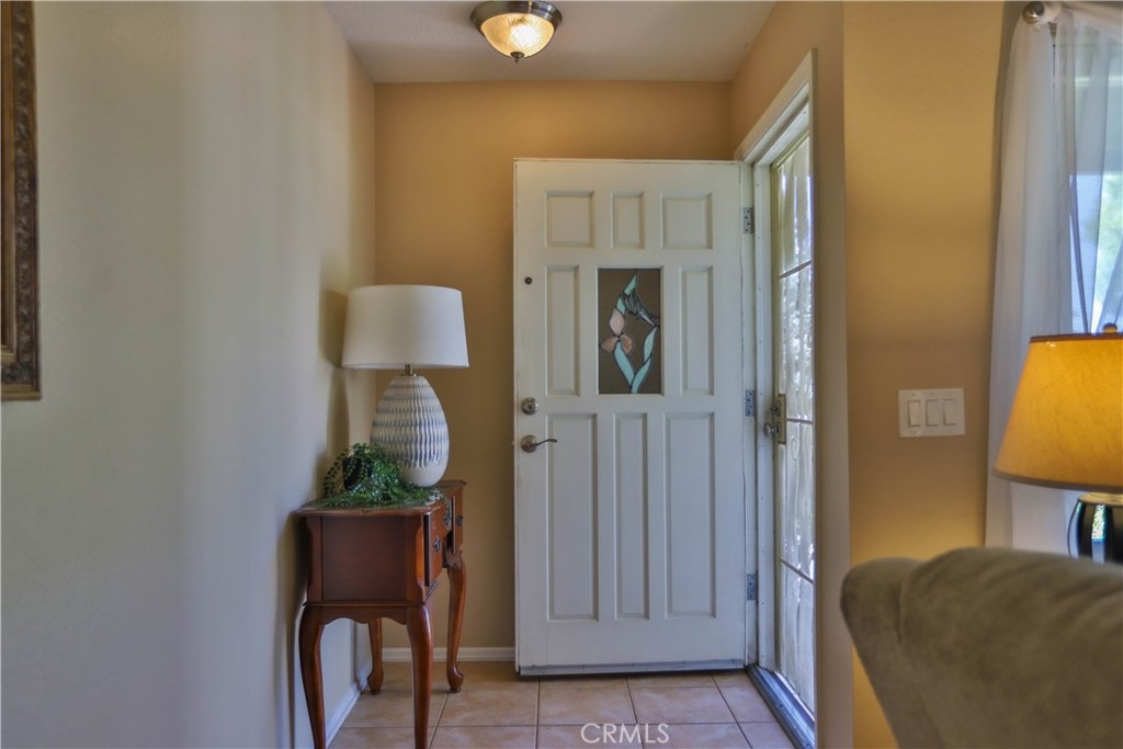 7241 Marine Avenue Rancho Cucamonga, CA 91701 - Photo 47 of 48 a bedroom with bed and a potted plant