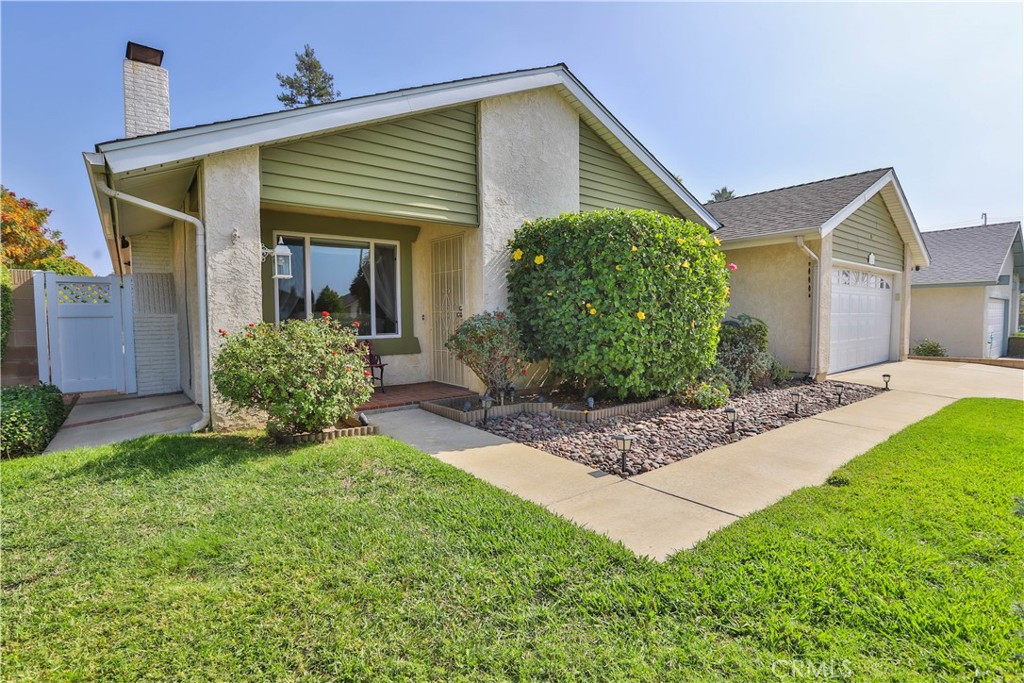 7241 Marine Avenue Rancho Cucamonga, CA 91701 - Photo 6 of 48 a front view of a house with garden