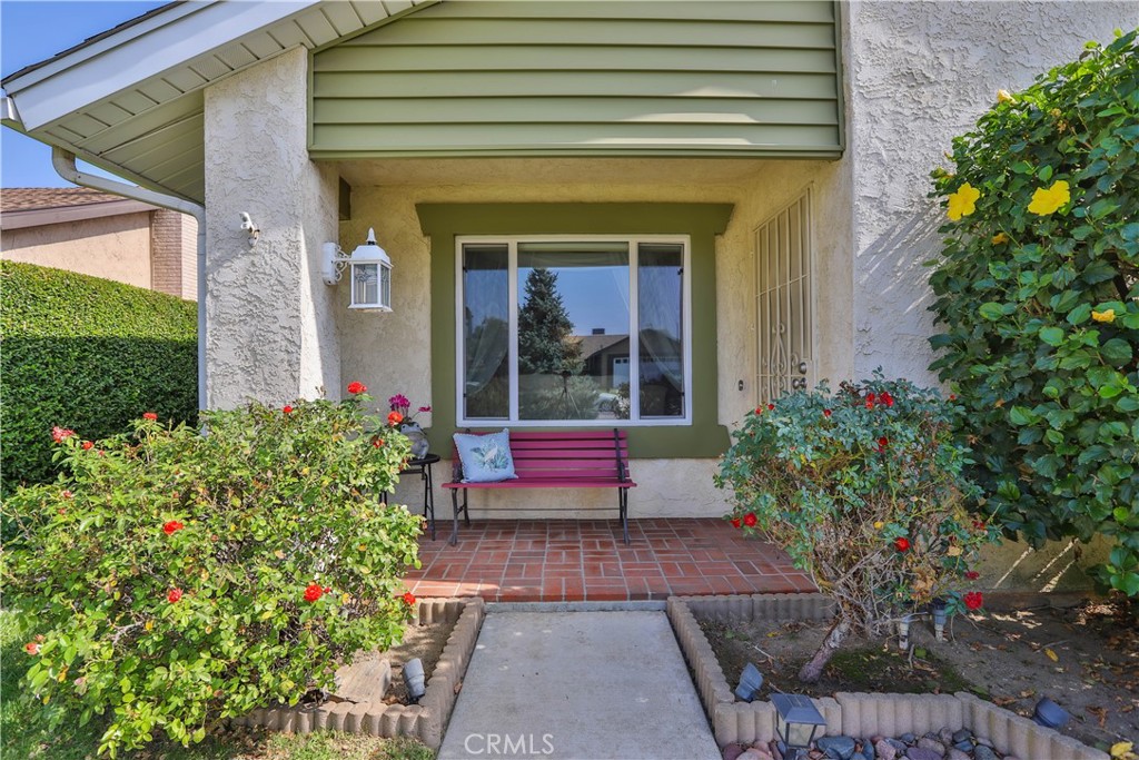 7241 Marine Avenue Rancho Cucamonga, CA 91701 - Photo 7 of 48 a flower garden is sitting in front of a house