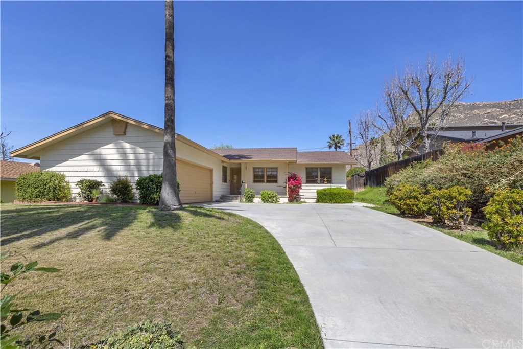 565 Massachusetts Avenue Riverside, CA 92507 - Photo 1 of 1 a front view of house with yard and green space