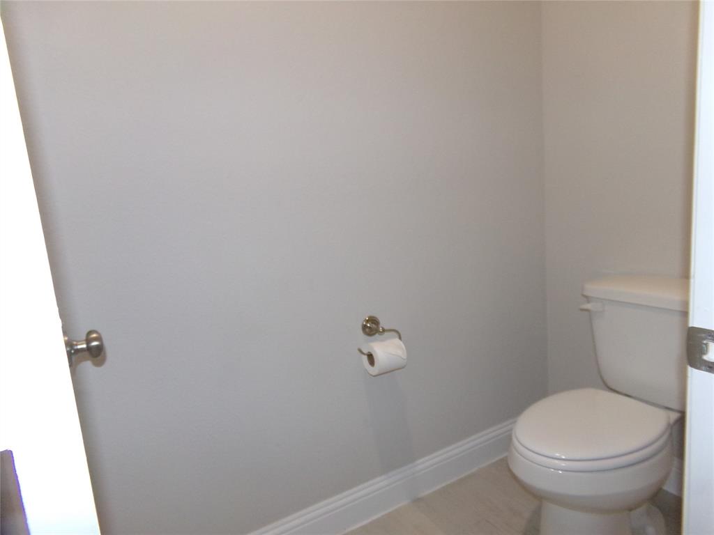 1748 Redding Street Allen, TX 75002 - Photo 16 of 33 Bathroom with baseboards and toilet