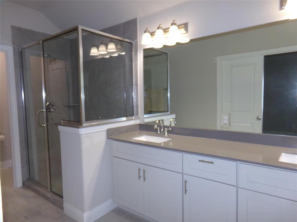 1748 Redding Street Allen, TX 75002 - Photo 16 of 33 a bathroom with a double vanity sink and mirror