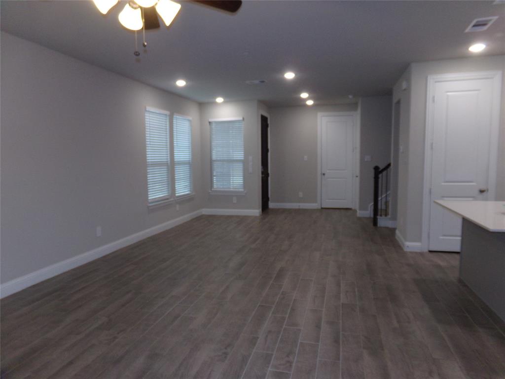 1748 Redding Street Allen, TX 75002 - Photo 27 of 33 an empty room with wooden floor and a window