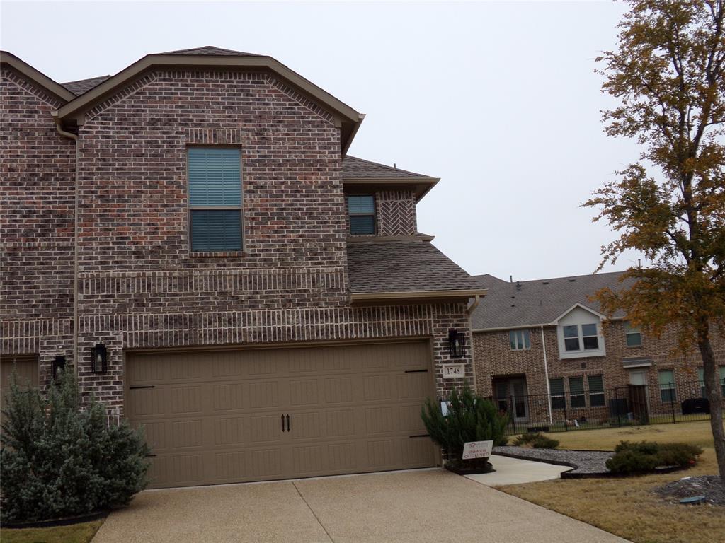 1748 Redding Street Allen, TX 75002 - Photo 2 of 33 View of front of house with brick siding, driveway, a shingled roof, and a garage